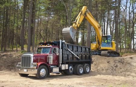 depositphotos 5638057 stock photo excavator loading dumper truck